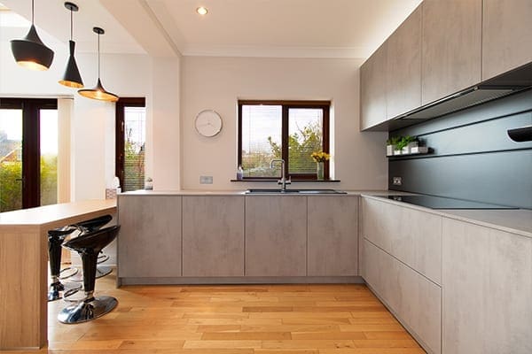 Artisan-installed Schüller kitchen with Elba concrete effect doors, showcasing modern German kitchen design in Cardiff