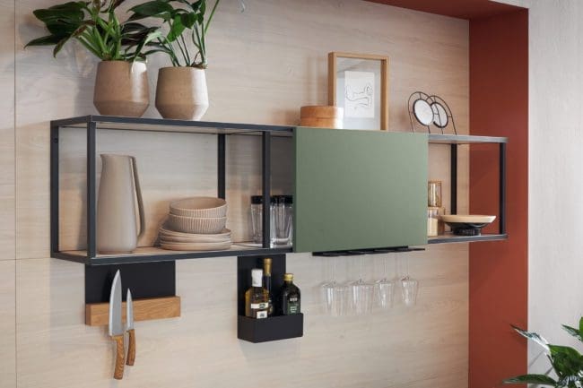 Image of a stylish wall unit in the Matera range, featuring a sleek, easy-to-use sliding door, revealing a spacious and neatly arranged storage area.