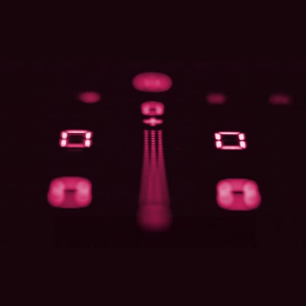 Image focused on the illuminated controls of a Bora cooktop, glowing in a soft red light that exemplifies 'simple operation'. The digital displays are crisp and clear, indicating the cooktop's easy-to-understand interface. This highlights Bora's commitment to user-friendly design, where elegance and simplicity ensure a seamless cooking experience.
